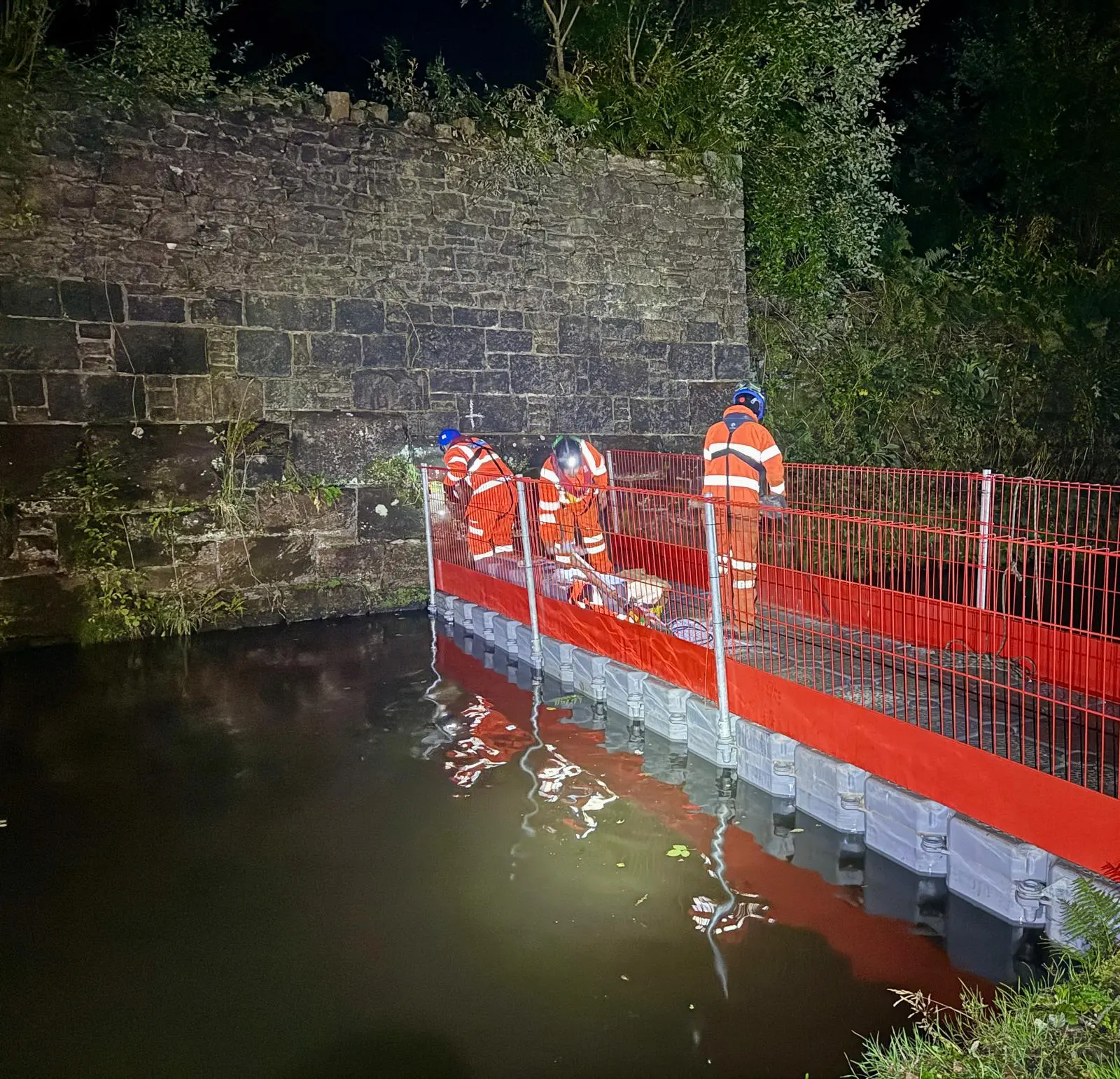 CRM operatives working from a modular pontoon at night